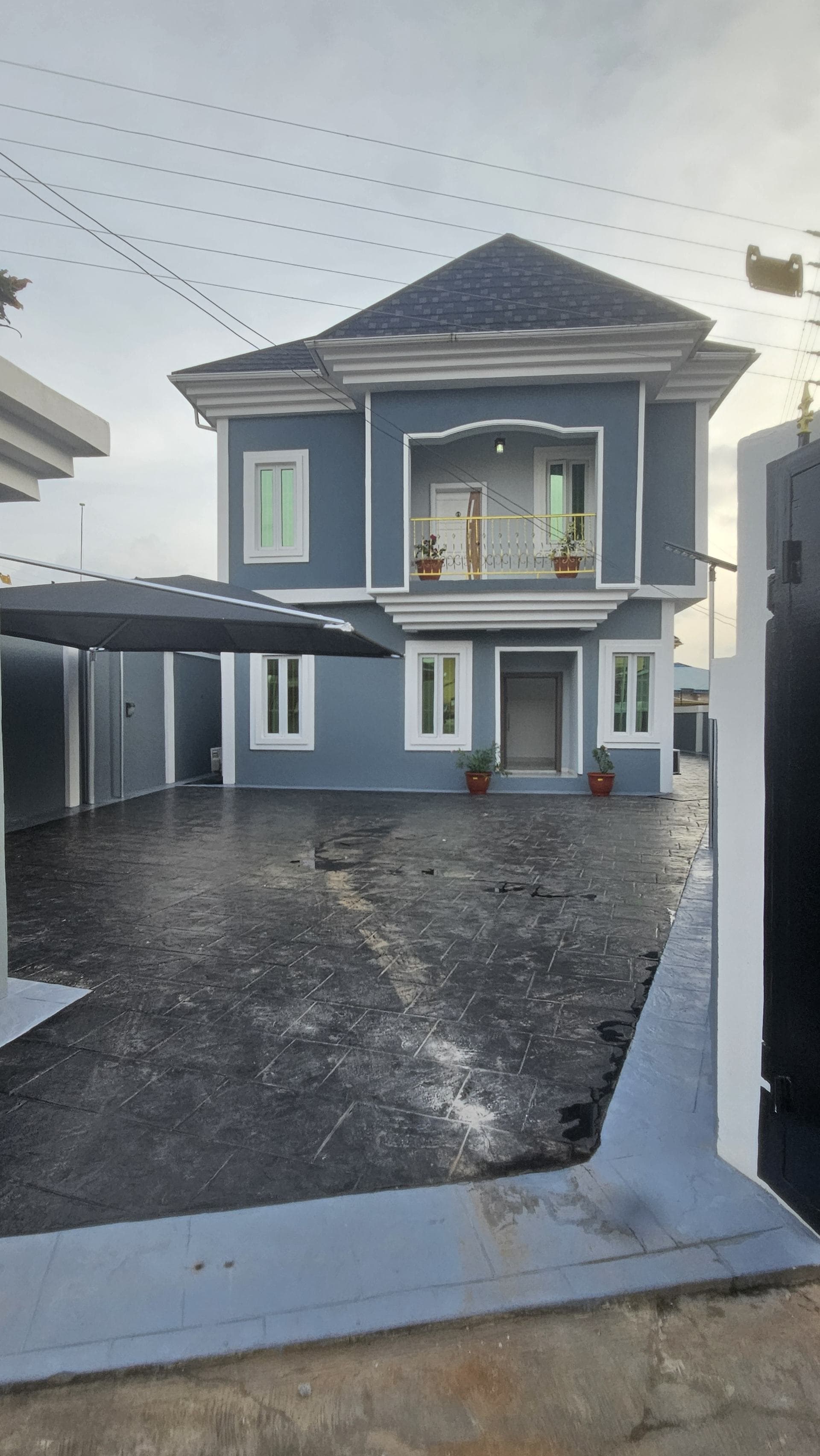 Completed home with paved courtyard